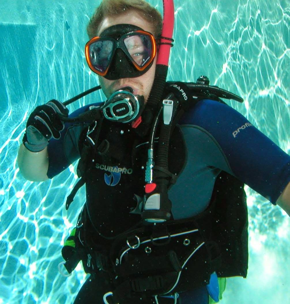 Brett learning scuba diving in a pool